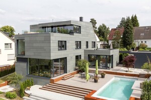 Das Wohnhaus unweit von Frankfurt am Main ist komplett mit Schiefer eingedeckt. Die Schiefersteine sind von außen nicht sichtbar auf einer Unterkonstruktion montiert Foto: Rathscheck Schiefer 