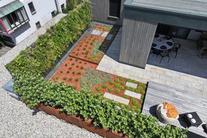  Die neue, L-förmig angelegte Dachterrasse verfügt über mehrere Pflanzbeete und Sitzgelegenheiten mit und ohne Überdachung 