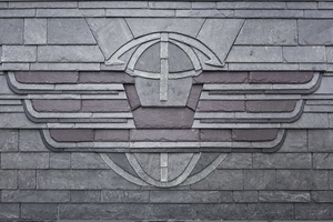  „Firmenlogo eines Logistikunternehmens“ als Schieferornament von Joel Masgai 